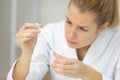 Woman scientist adding liquid to test tube with pipette Royalty Free Stock Photo