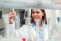 Woman scientist carrying out experiment in research laboratory Royalty Free Stock Photo