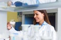 Woman scientist carrying out experiment in research laboratory