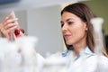 Woman scientist carrying out experiment in research laboratory Royalty Free Stock Photo