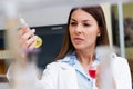 Woman scientist carrying out experiment in research laboratory Royalty Free Stock Photo