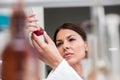 Woman scientist carrying out experiment in research laboratory Royalty Free Stock Photo