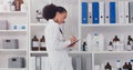 Woman, scientist and clipboard for inventory in lab stock room for equipment check and analyse products. Female Royalty Free Stock Photo