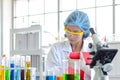 Woman scientist doing check list the experiment. Royalty Free Stock Photo