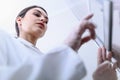 Woman Scientist in Facility Typing on Control Panel Royalty Free Stock Photo