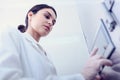 Woman Scientist in Facility Typing on Control Panel Royalty Free Stock Photo