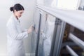 Woman Scientist in Facility Typing on Control Panel Royalty Free Stock Photo