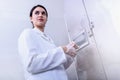 Woman Scientist in Facility Typing on Control Panel Royalty Free Stock Photo