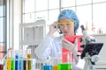 Woman scientist doing experiment and check list. Royalty Free Stock Photo