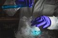 A woman scientist performing Organic reaction under fuming condition in a laboratory