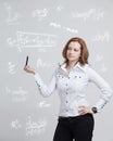 Woman scientist or student with pen working with various high school maths and science formula. Royalty Free Stock Photo