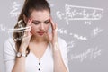 Woman scientist or student working with various high school maths and science formula. Royalty Free Stock Photo
