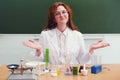 Woman scientist with test tubes and flasks on the table. Conducting scientific research in the student laboratory Royalty Free Stock Photo