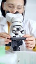 Woman scientist using microscope in laboratory. Microbiology science concept Royalty Free Stock Photo