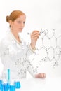 Woman scientist write chemical formula