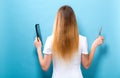 Woman with scissors and comb in salon hair cutting theme Royalty Free Stock Photo