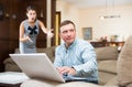 Woman scolding her husband using laptop