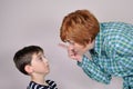 Woman scolding a scared young boy Royalty Free Stock Photo