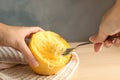 Woman scraping flesh of cooked spaghetti squash Royalty Free Stock Photo