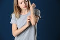 Woman scratching forearm. Allergy symptom Royalty Free Stock Photo