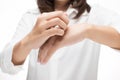 Woman scratching her arm Royalty Free Stock Photo