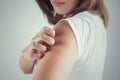 Woman scratching her arm. Royalty Free Stock Photo