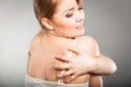 woman scratching her itchy back with allergy rash Royalty Free Stock Photo