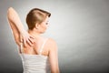 Woman scratching her itchy back with allergy rash Royalty Free Stock Photo