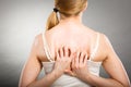 Woman scratching her itchy back with allergy rash Royalty Free Stock Photo