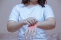 woman scratching the itch on her hands allergic reaction to insect bites, dermatitis, food, drugs