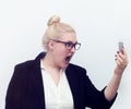 Woman screaming at cell phone on white Royalty Free Stock Photo