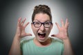 Woman screaming in horror, grimace portrait