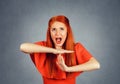 Woman screaming looking up with rage expression showing time out with hands Royalty Free Stock Photo