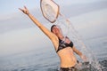 Woman in sea water with splashes.