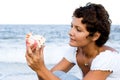 Woman on seacoast with a cockleshell Royalty Free Stock Photo