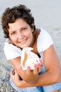 Woman on seacoast with a cockleshell in hands Royalty Free Stock Photo