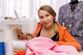 Woman seamstress playing with daughter interrupting work Royalty Free Stock Photo