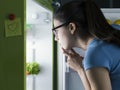 Woman searching for food in the fridge Royalty Free Stock Photo