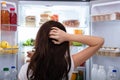 Woman Searching For Food In Refrigerator Royalty Free Stock Photo