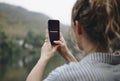 Woman searching for signal with her mobile phone Royalty Free Stock Photo