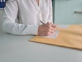 Woman secretary checks received correspondence at workplace