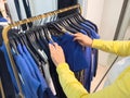 Woman Selecting Caroll Brand Garments