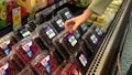 Woman selecting mulberry in grocery store