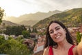 Woman self-potrait in a small village in mountain valley. Rural tourism and nature concept. Spain. Royalty Free Stock Photo