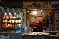 CANTON, CHINA Ã¢â¬â CIRCA MAY 2020: Woman selling cantonese local speciality roast ducks and steam chickens.