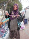Woman selling cheap jewelry at a street stall