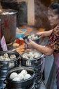 Woman selling delicious traditional chinese dumplings
