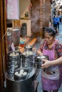 Woman selling delicious traditional chinese dumplings