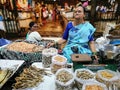 Woman selling dried fish, bombil, dried shrimps and prawns in Dadar vegetable market, Mumbai.