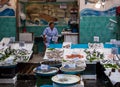 Woman selling fish at market in Naples Royalty Free Stock Photo